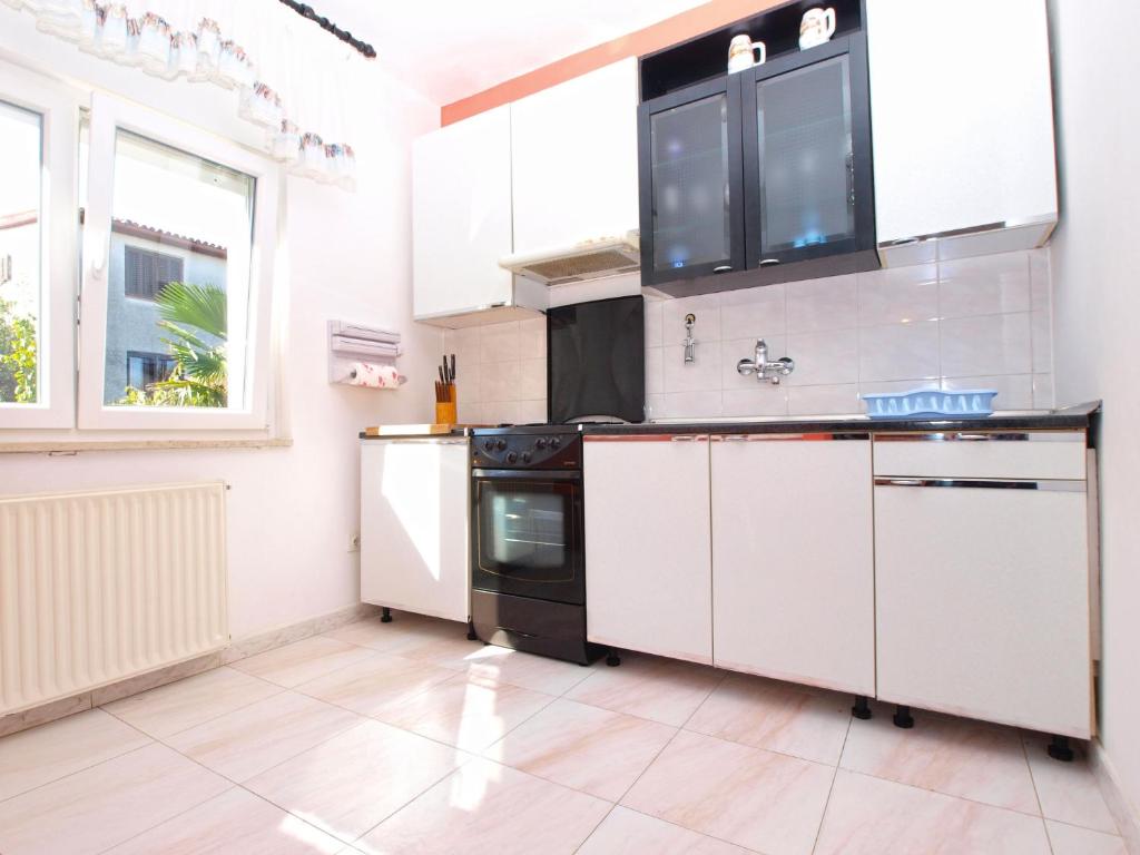 Kuchyň nebo kuchyňský kout v ubytování Apartments Nadia 1493