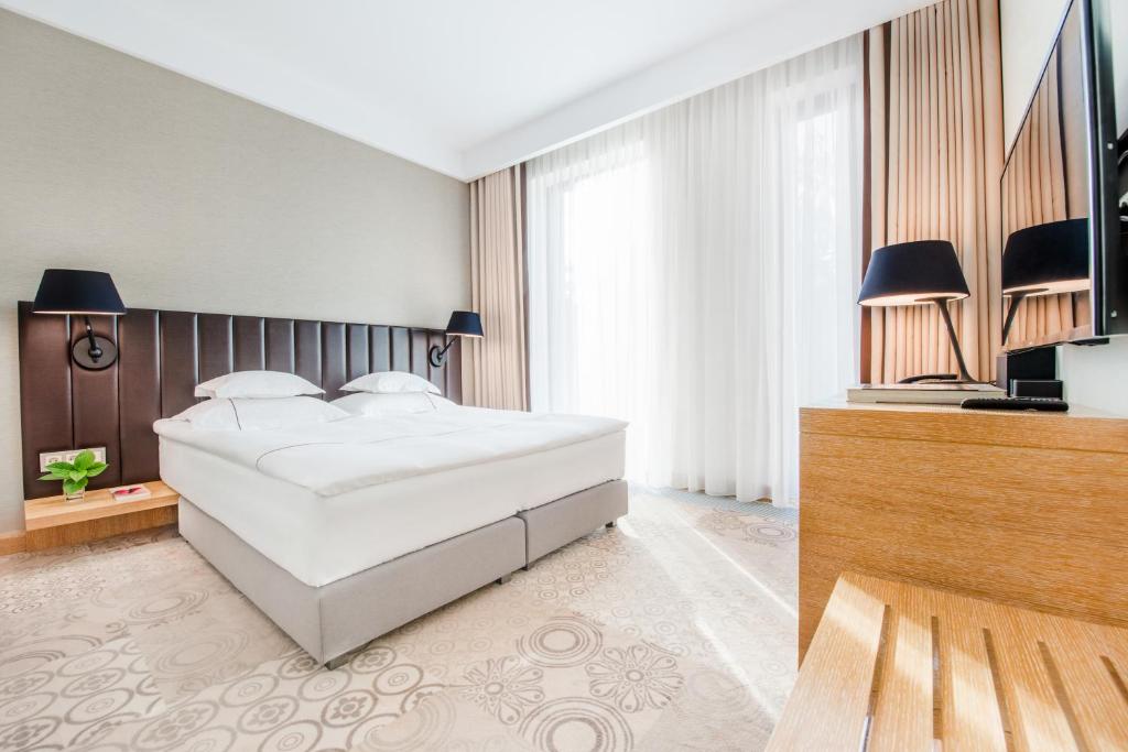 Posteľ alebo postele v izbe v ubytovaní Tiffi Boutique Hotel