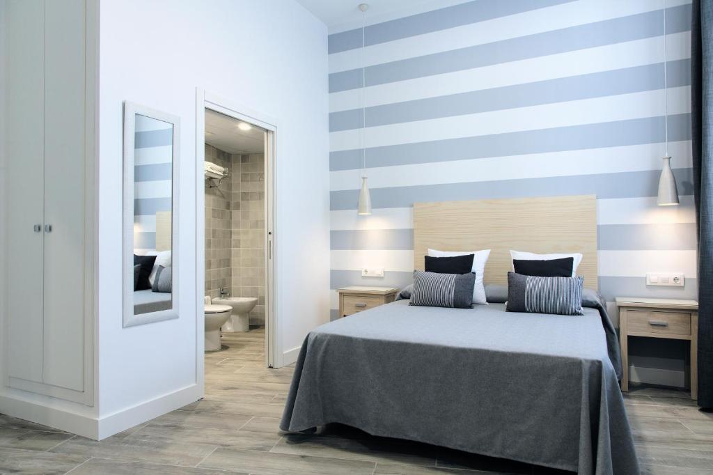 Posteľ alebo postele v izbe v ubytovaní Hotel Apartamentos MPD