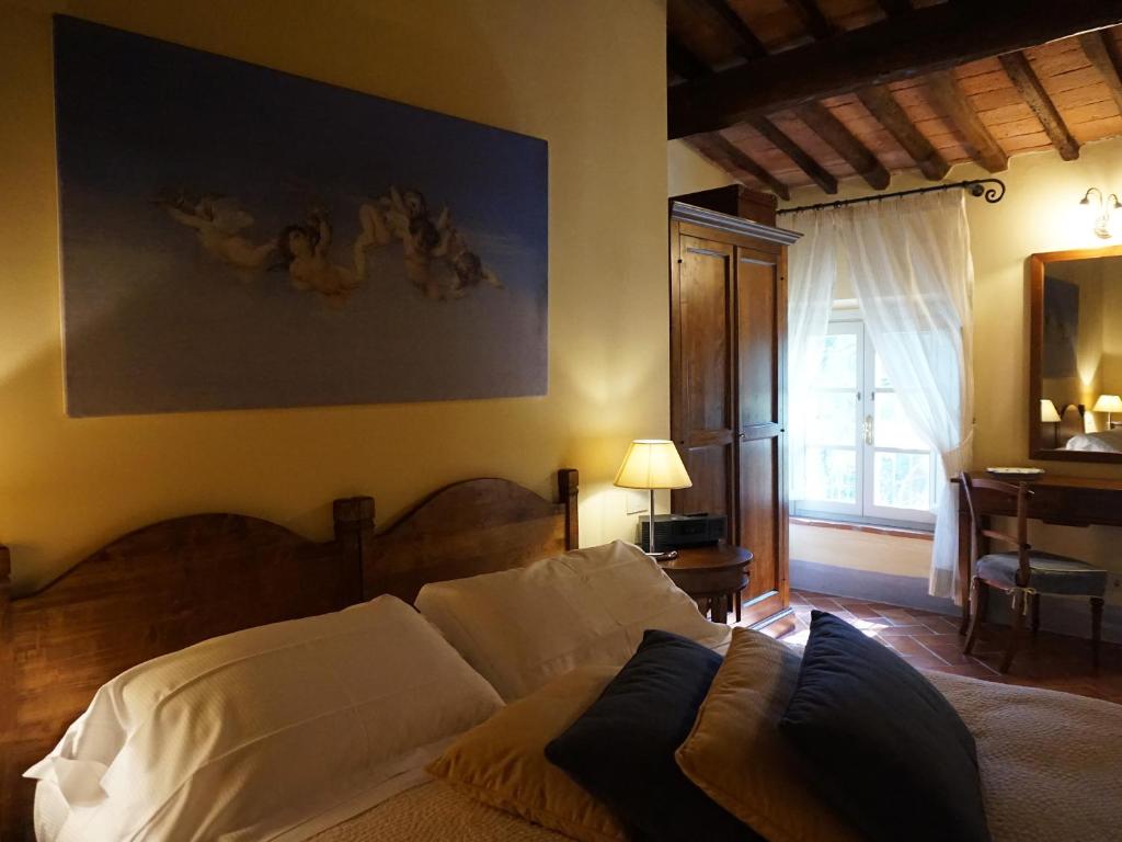 Posteľ alebo postele v izbe v ubytovaní Borgo Colleoli Resort