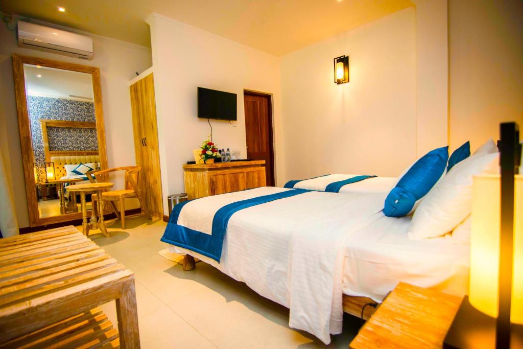 Postel nebo postele na pokoji v ubytování Rivora Residence