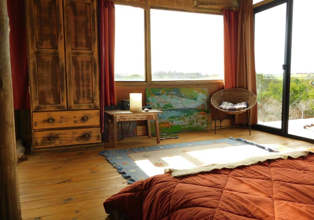 Postel nebo postele na pokoji v ubytování Casa Aguai