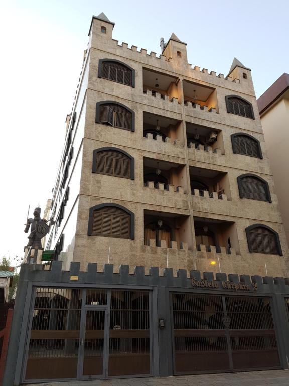 a tall building with a lot of windows at Capao da canoa Apto. 3 dorm in Capão da Canoa