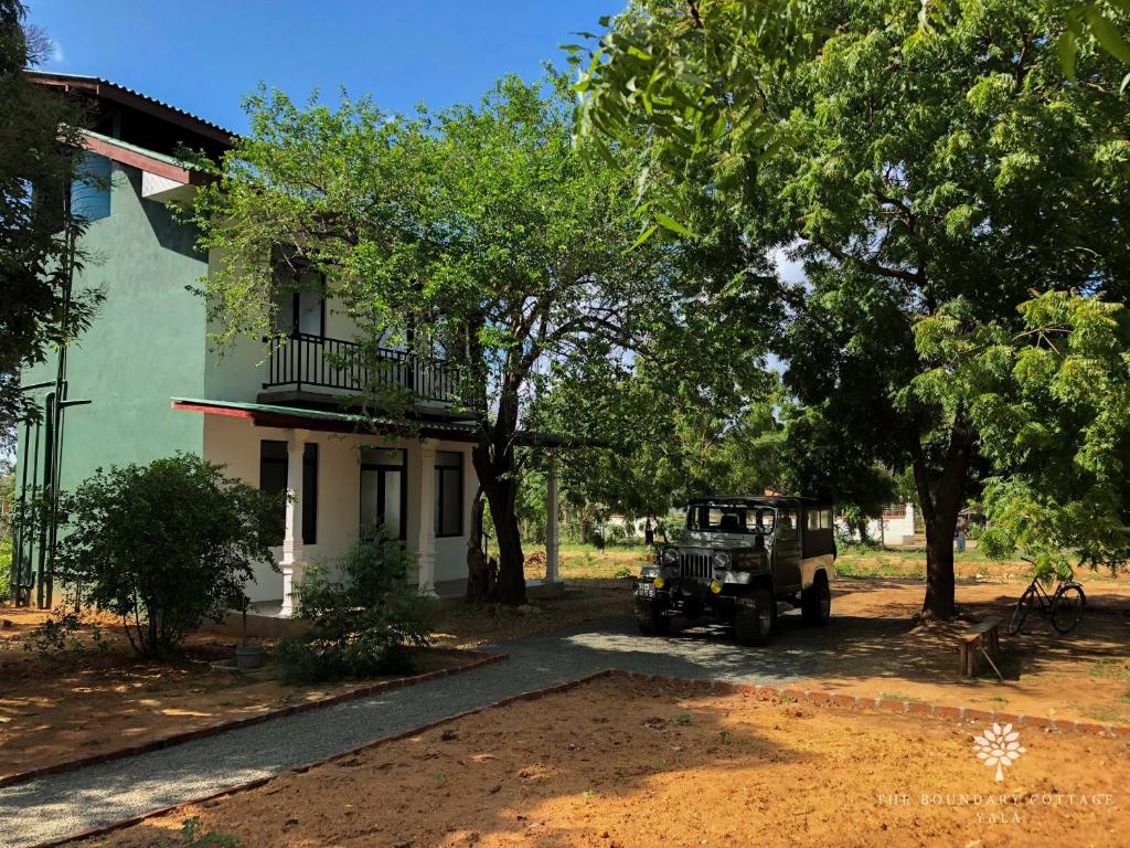 a jeep parked in front of a house at The Boundary Yala in Kataragama