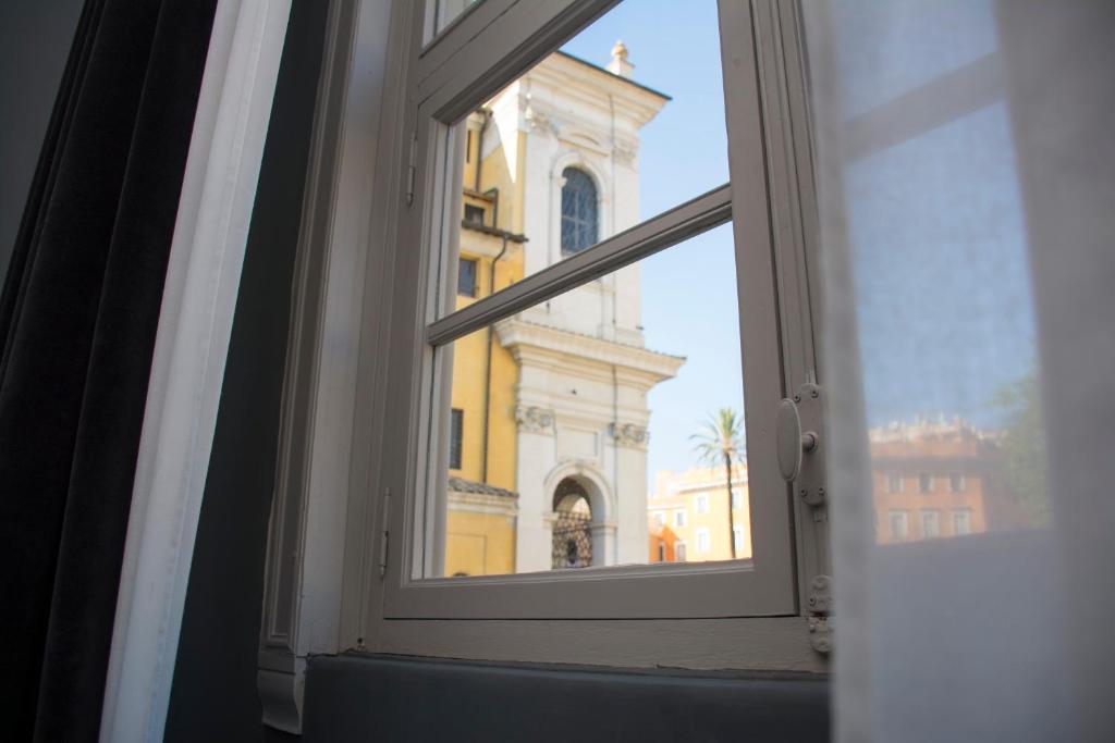an open window with a view of a building at Roma Luxus Hotel in Rome