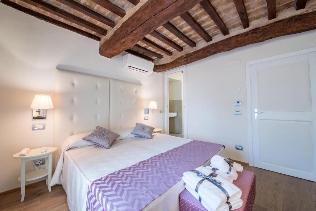Postel nebo postele na pokoji v ubytování Hotel Il Palazzo
