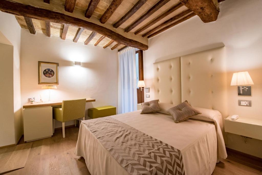 Postel nebo postele na pokoji v ubytování Hotel Il Palazzo