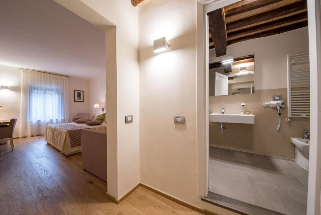 Postel nebo postele na pokoji v ubytování Hotel Il Palazzo