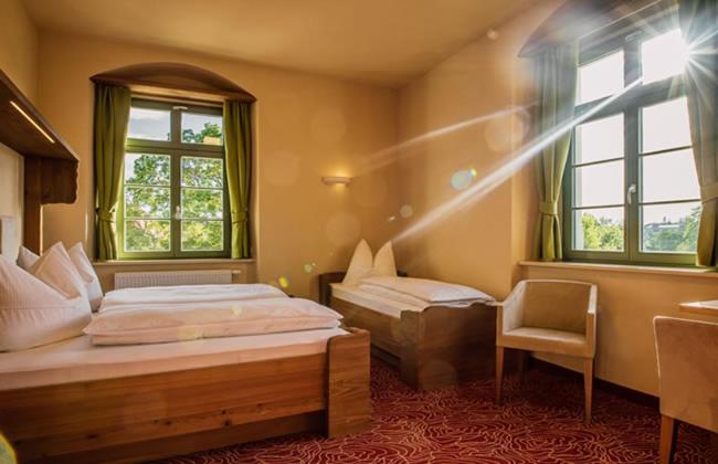 Postel nebo postele na pokoji v ubytování Hotel Freyhof