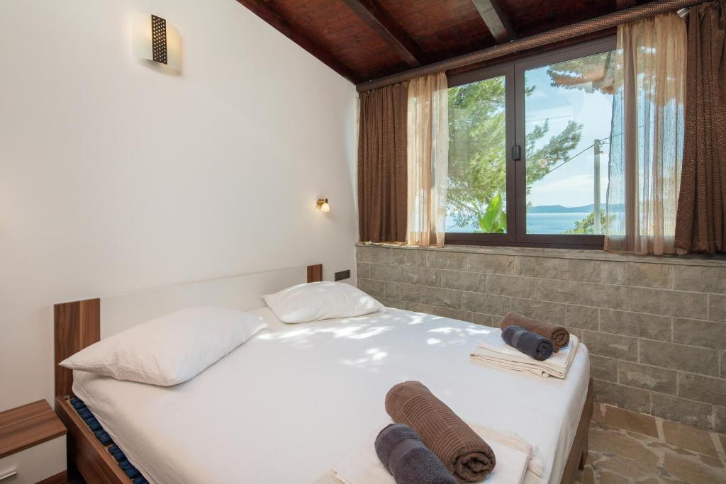 Posteľ alebo postele v izbe v ubytovaní Beach Time Villa