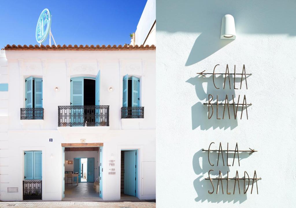 a white building with a sign on the side of it at Apartamentos La más Bonita in Valencia
