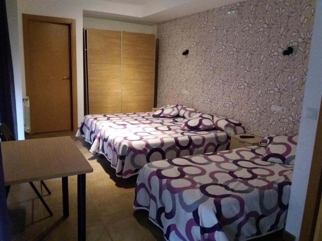 Postel nebo postele na pokoji v ubytování Hostal la Catedral