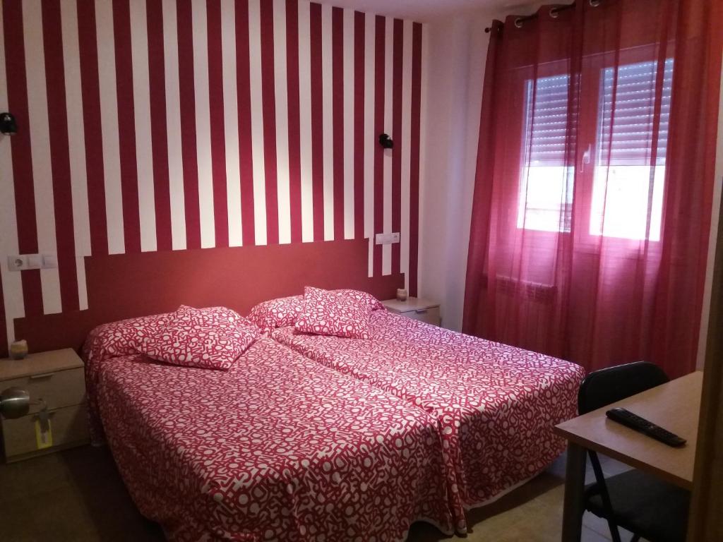Postel nebo postele na pokoji v ubytování Hostal la Catedral