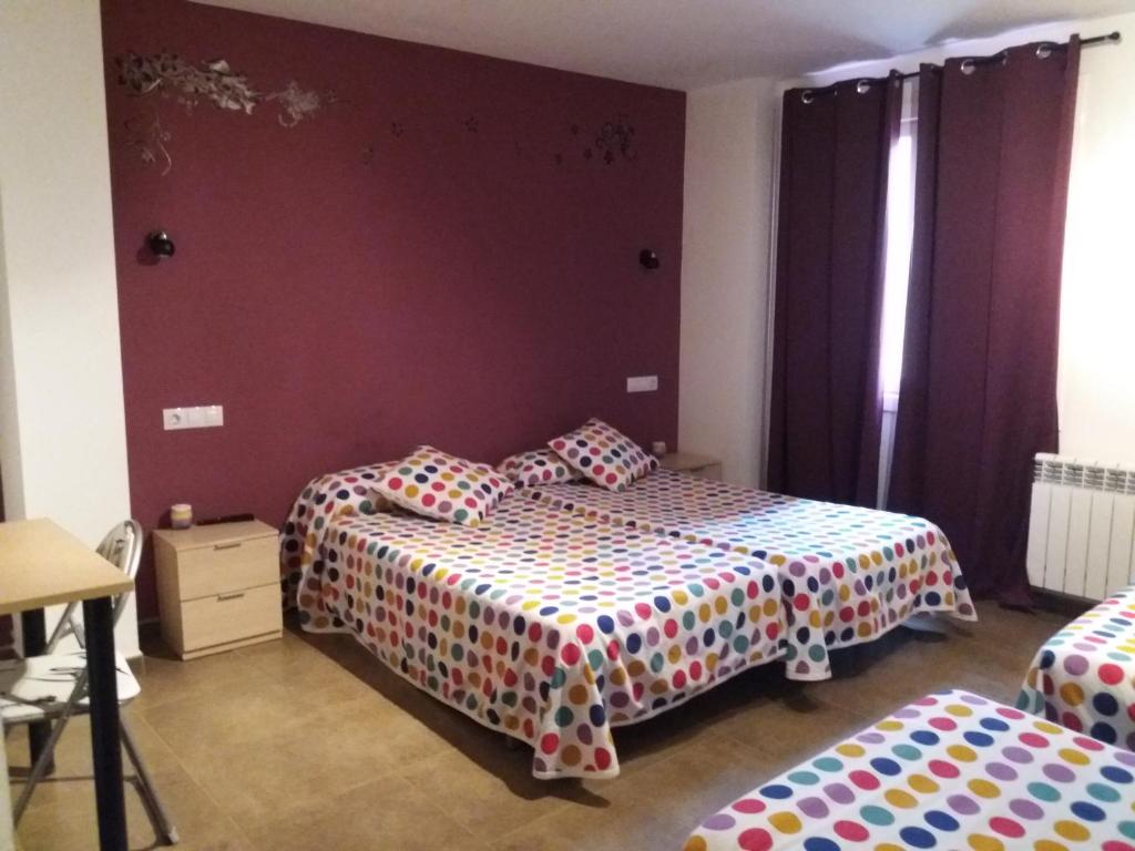 Postel nebo postele na pokoji v ubytování Hostal la Catedral