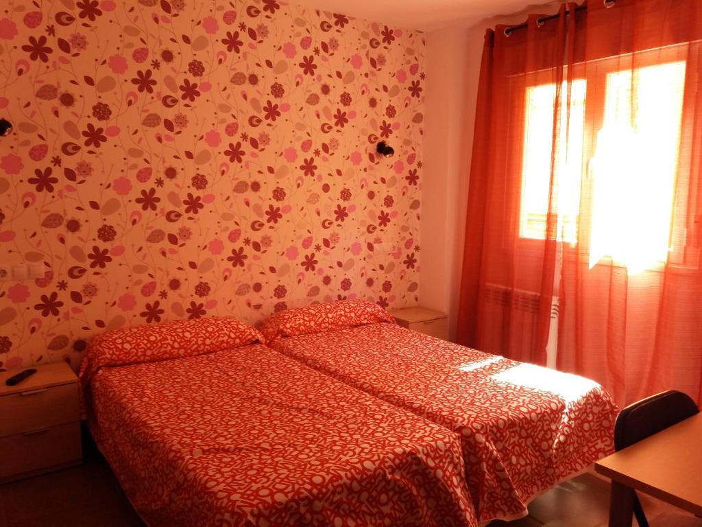Postel nebo postele na pokoji v ubytování Hostal la Catedral