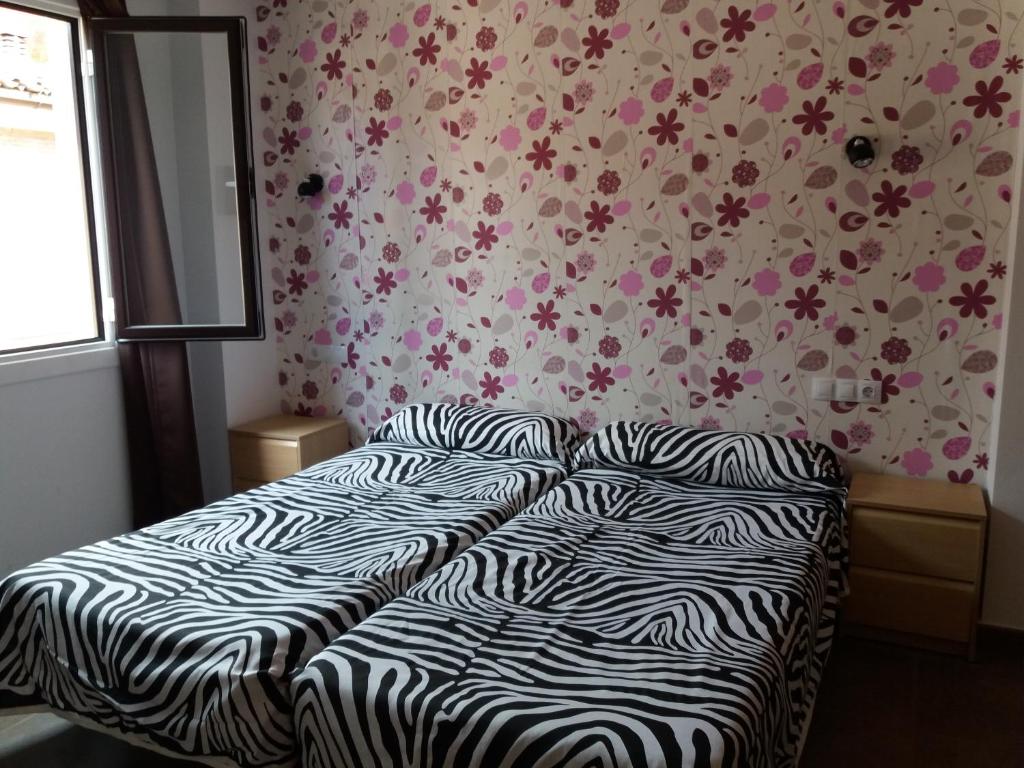 Postel nebo postele na pokoji v ubytování Hostal la Catedral