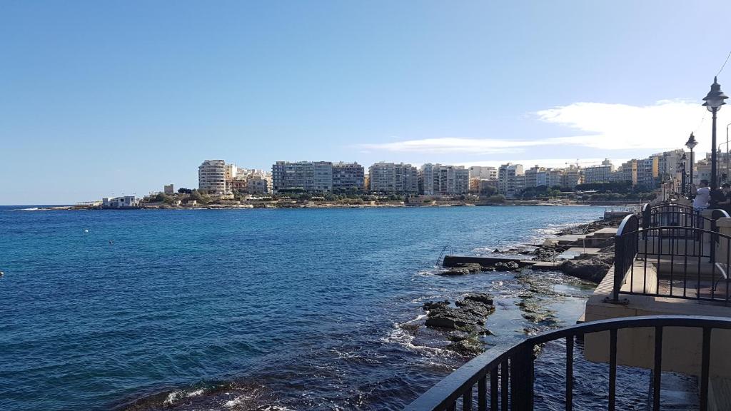 a view of a body of water with a city at Spinola Seafront Apartment in St Julian's