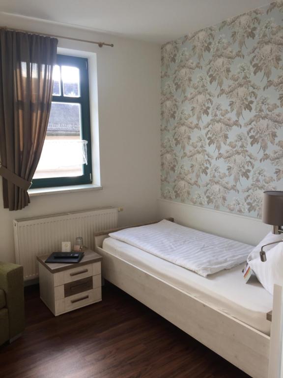 Postel nebo postele na pokoji v ubytování Hotel Trendtino