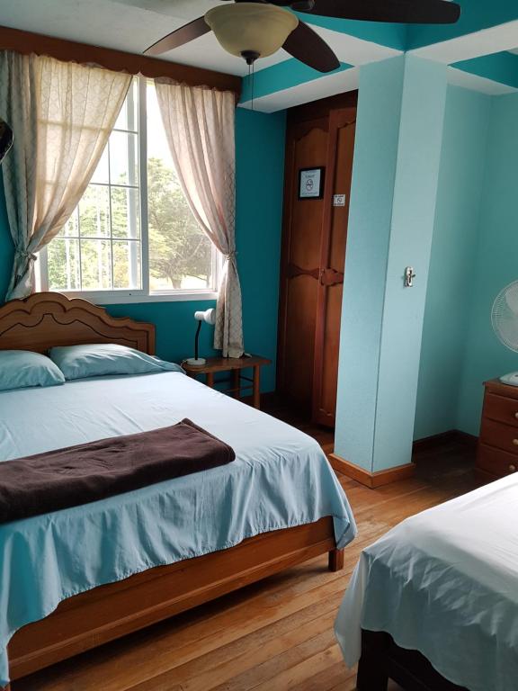 Postel nebo postele na pokoji v ubytování Residencial El Valle