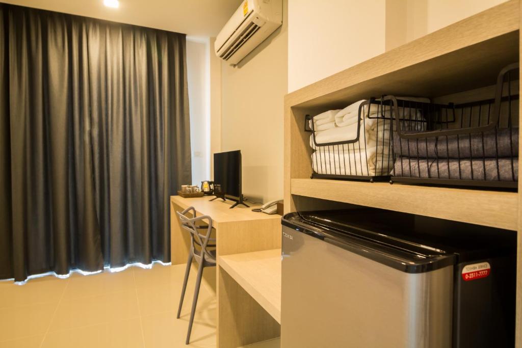 Kuchyň nebo kuchyňský kout v ubytování Triple Z Hotel