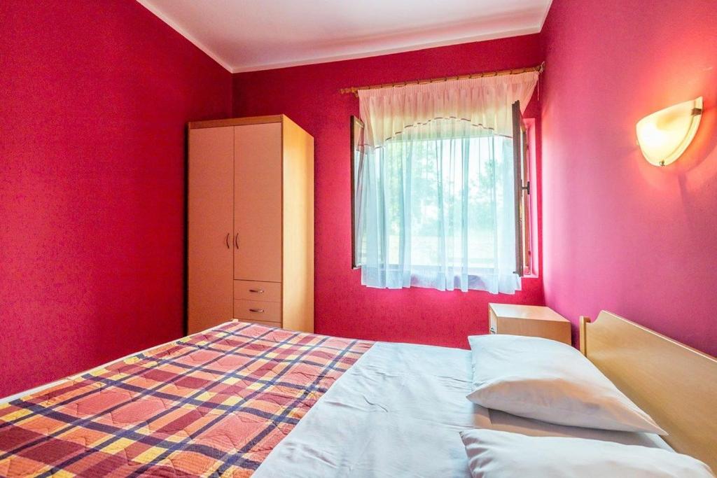 Postel nebo postele na pokoji v ubytování Apartments Vitomir