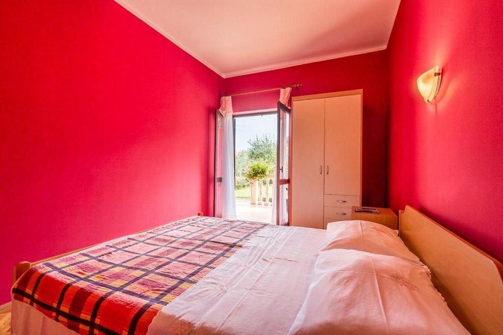 Postel nebo postele na pokoji v ubytování Apartments Vitomir