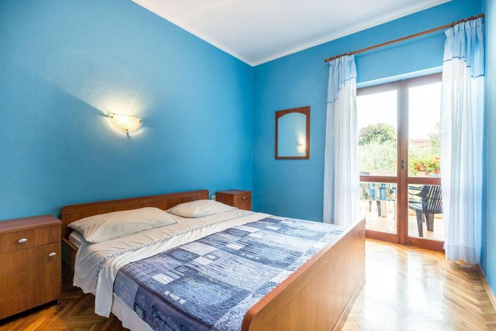 Postel nebo postele na pokoji v ubytování Apartments Vitomir