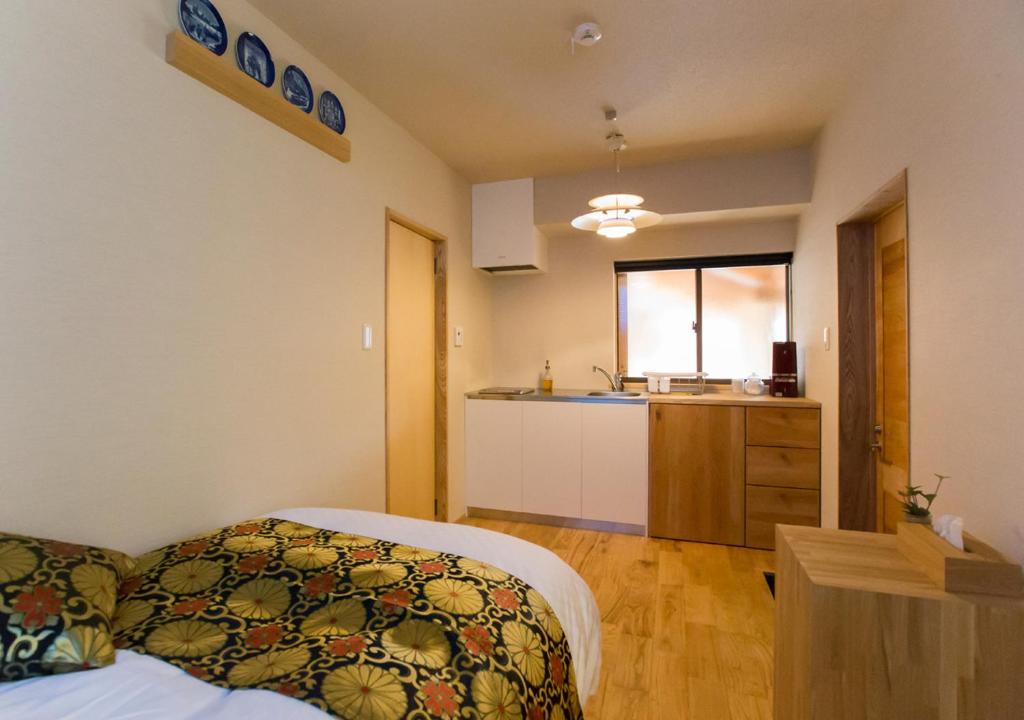 Postel nebo postele na pokoji v ubytování Shioriya