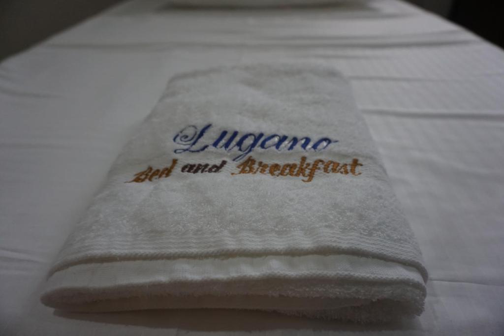 Postel nebo postele na pokoji v ubytování Lugano Bed and Breakfast