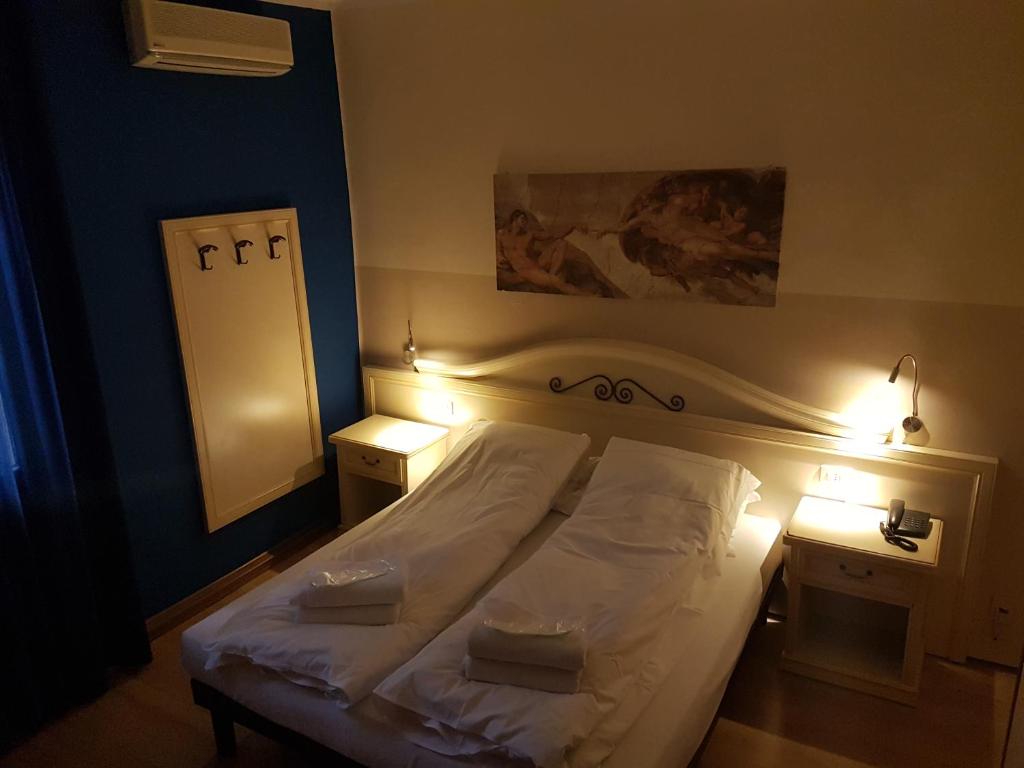 Postel nebo postele na pokoji v ubytování Hotel La Terrazza