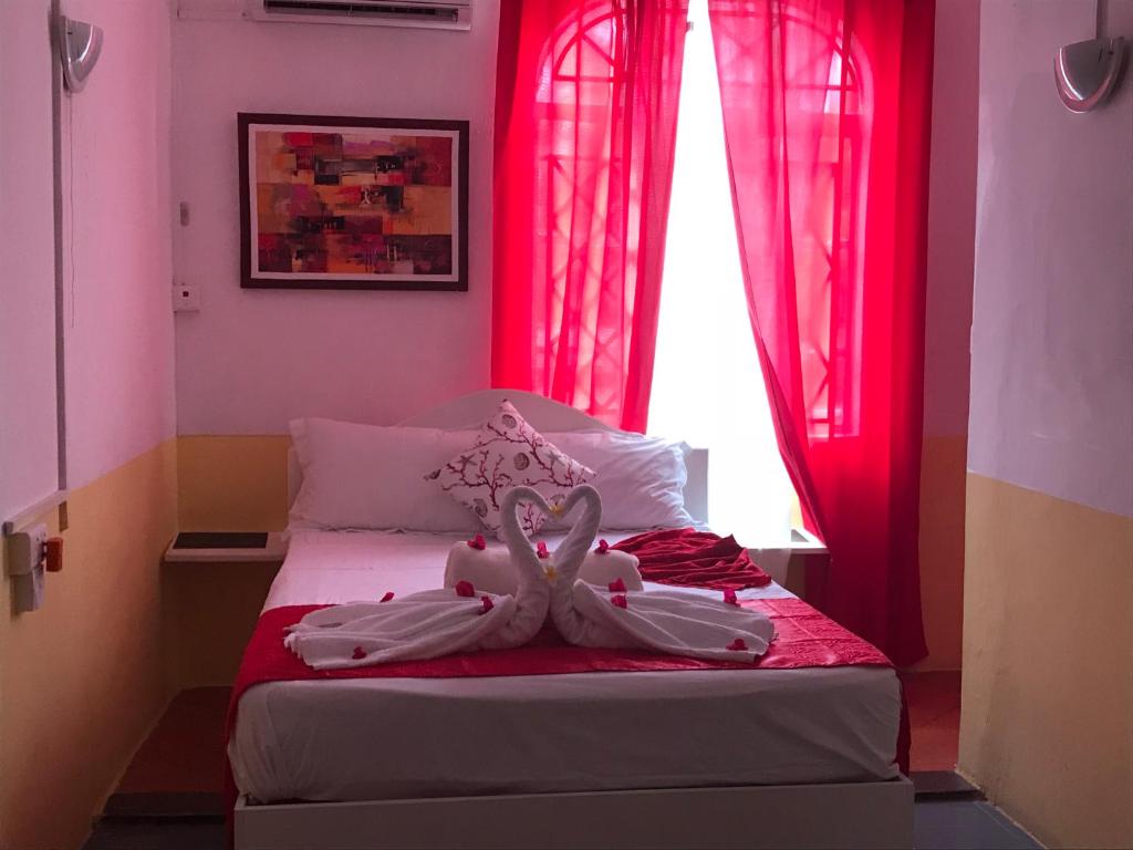 Postel nebo postele na pokoji v ubytování Eden Villa