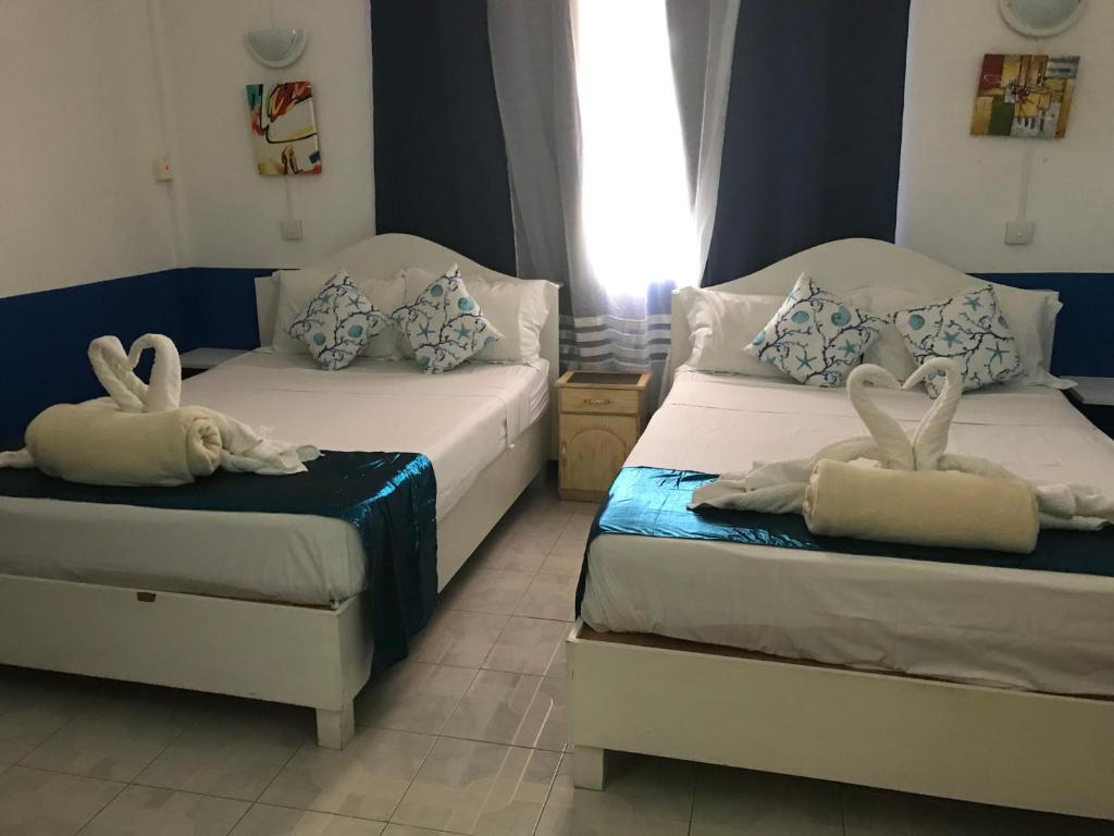 Postel nebo postele na pokoji v ubytování Eden Villa