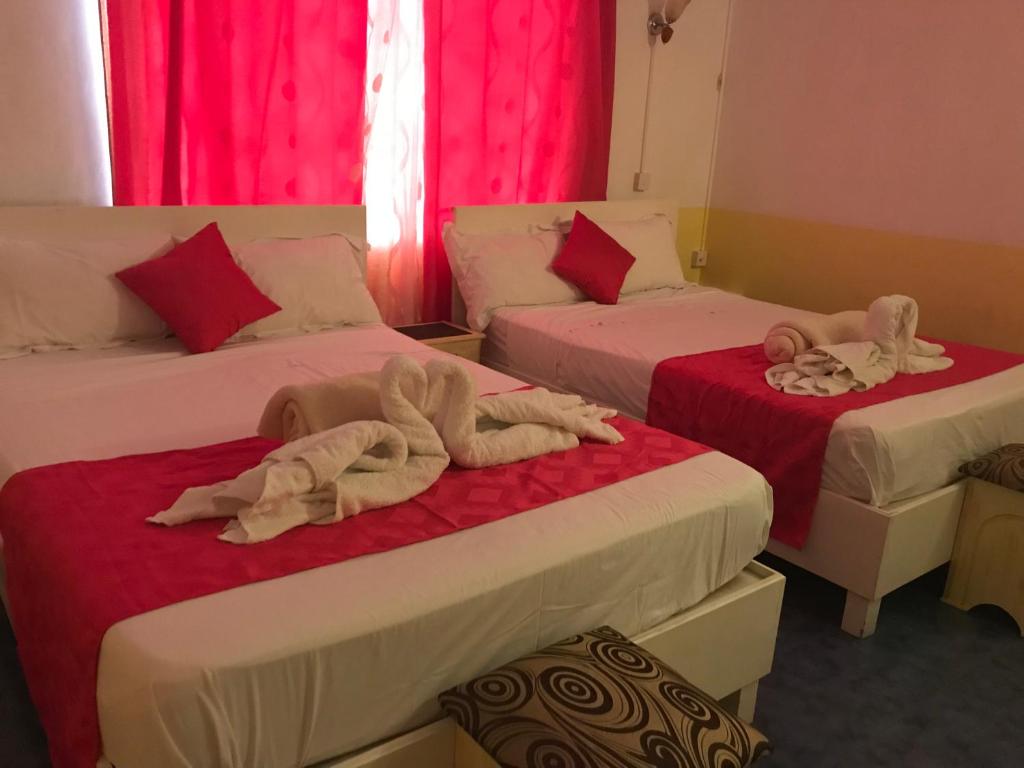 Postel nebo postele na pokoji v ubytování Eden Villa