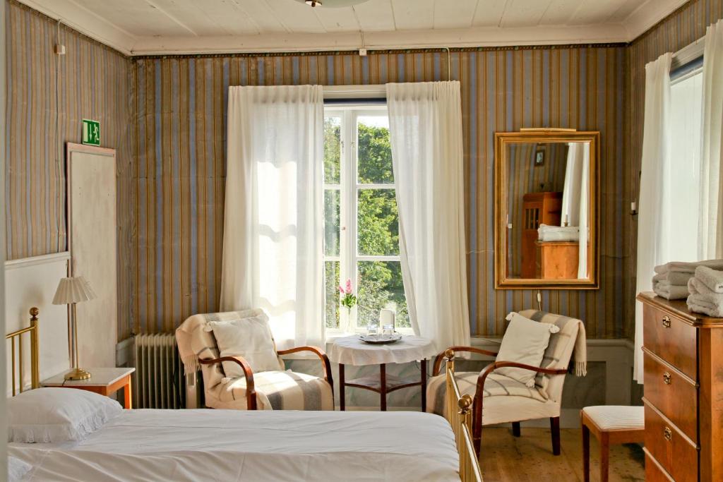 Postel nebo postele na pokoji v ubytování Frägsta Hälsingegård B&B