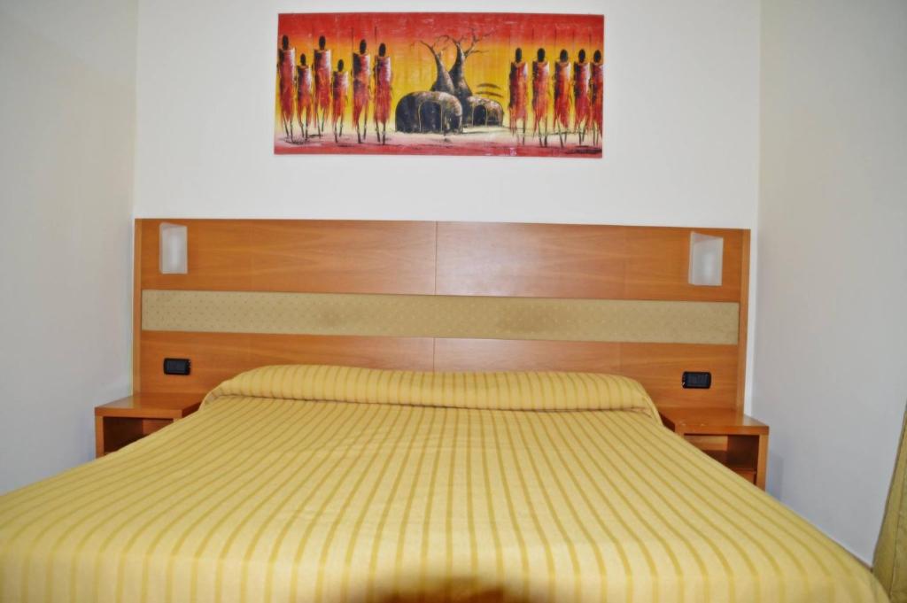 Postel nebo postele na pokoji v ubytování Hotel Moscatello