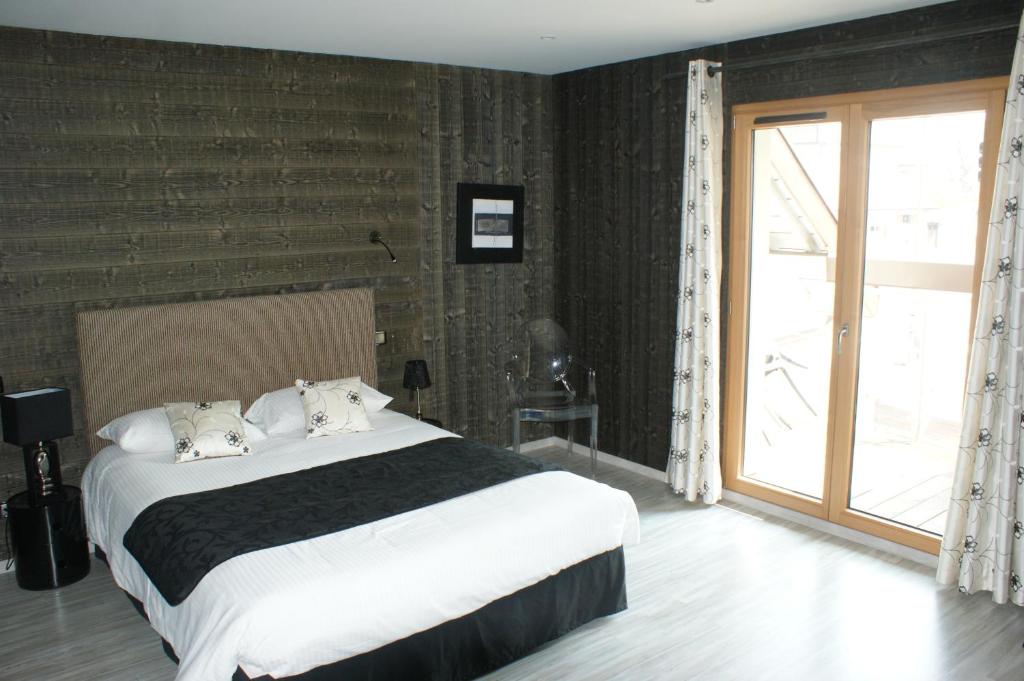 Postel nebo postele na pokoji v ubytování Hotel Blanc