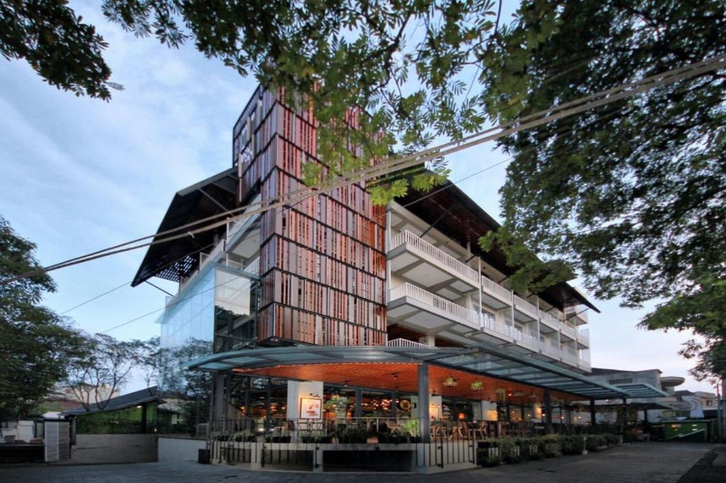 a rendering of a building with a glass facade at Hay Bandung in Bandung