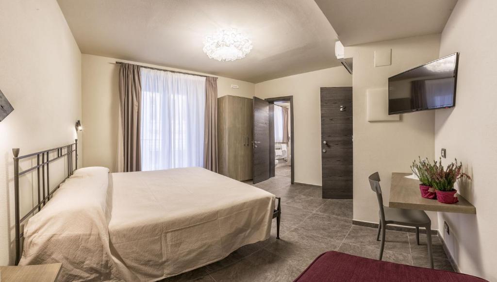 Postel nebo postele na pokoji v ubytování Borgomaestro B&B