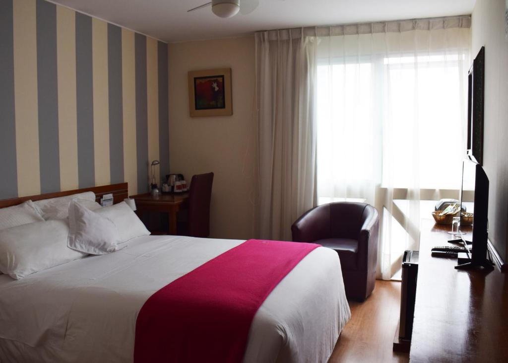 Ένα ή περισσότερα κρεβάτια σε δωμάτιο στο Hotel Boutique Runcu Miraflores