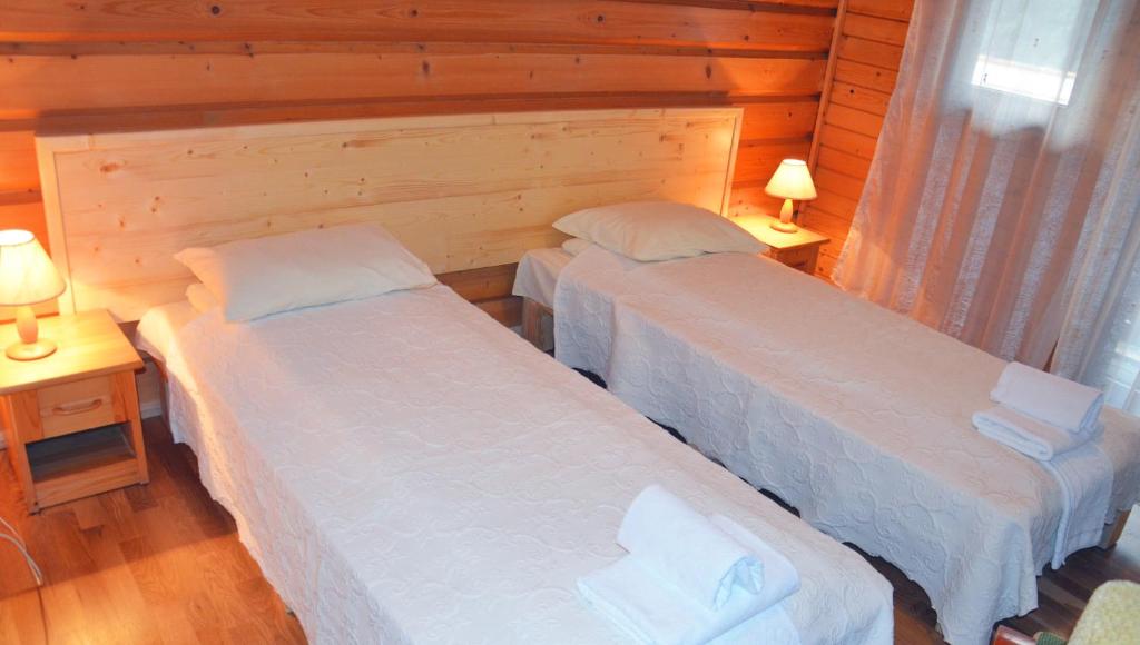 Postel nebo postele na pokoji v ubytování Zajazd Beskidy