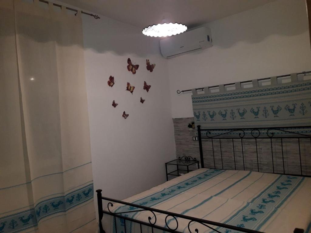 Łóżko lub łóżka w pokoju w obiekcie La Piazzetta