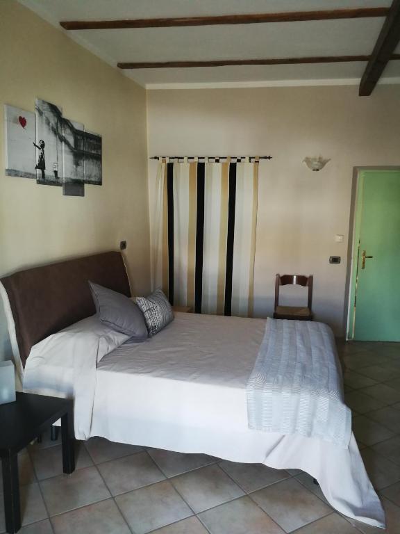 Łóżko lub łóżka w pokoju w obiekcie Locanda Montecarlo