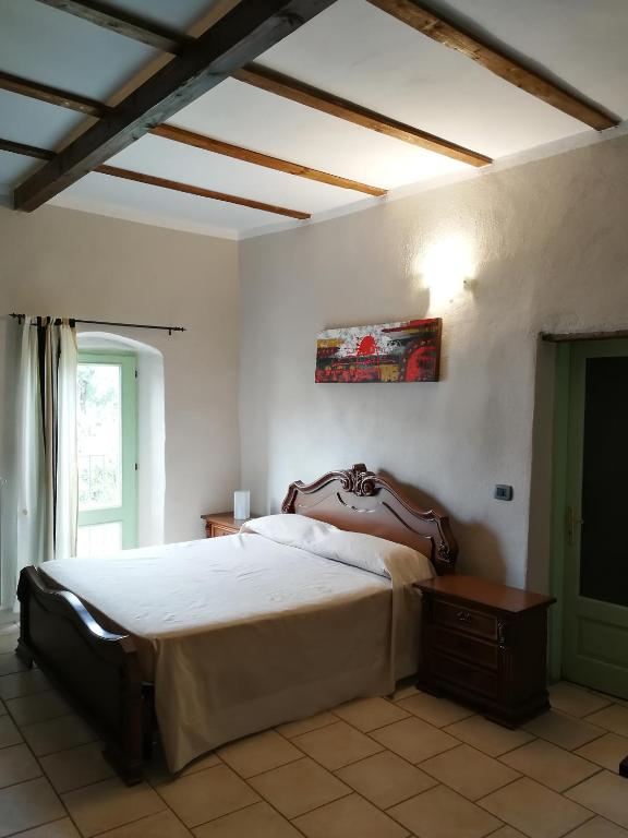 Łóżko lub łóżka w pokoju w obiekcie Locanda Montecarlo