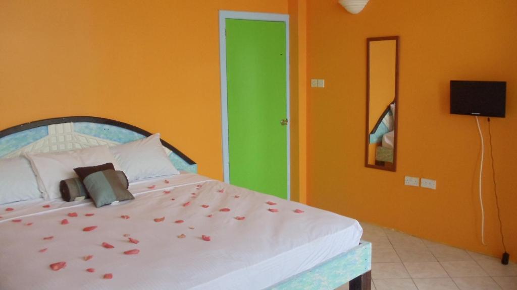 Postel nebo postele na pokoji v ubytování Villa Des Pitons