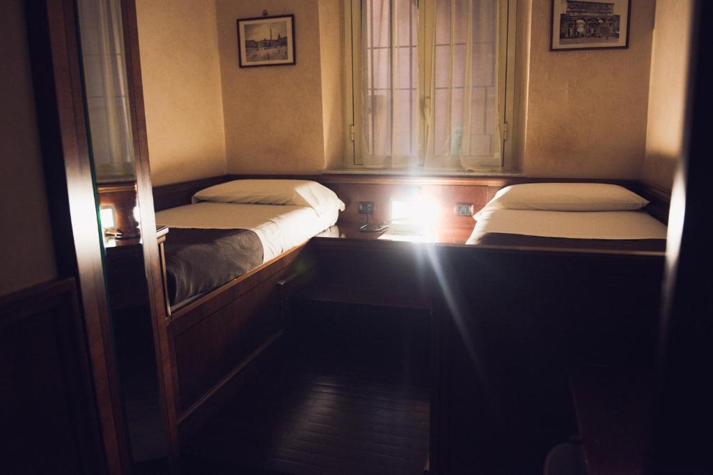 Postel nebo postele na pokoji v ubytování Hotel Robinson