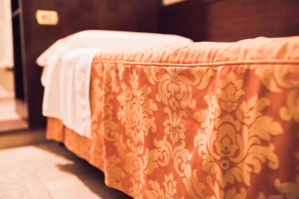 Postel nebo postele na pokoji v ubytování Hotel Robinson