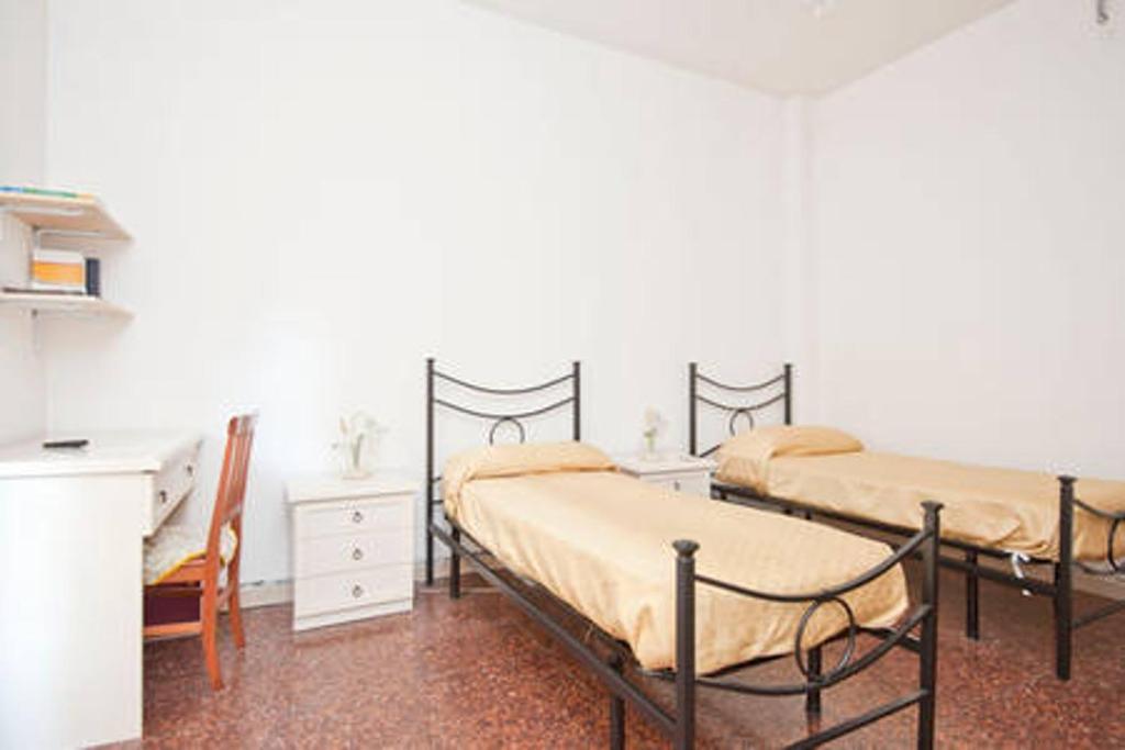เตียงในห้องที่ Alloggio turistico P.Lodi