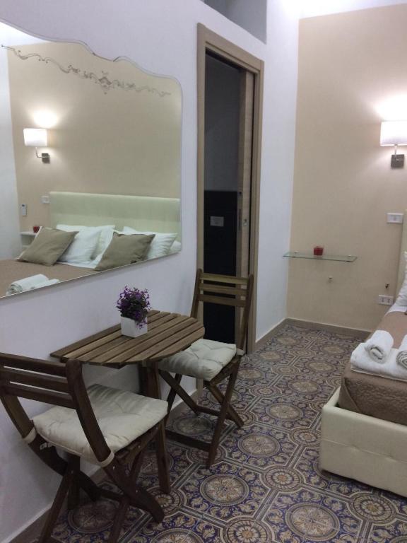 A bed or beds in a room at Decumani Prestige