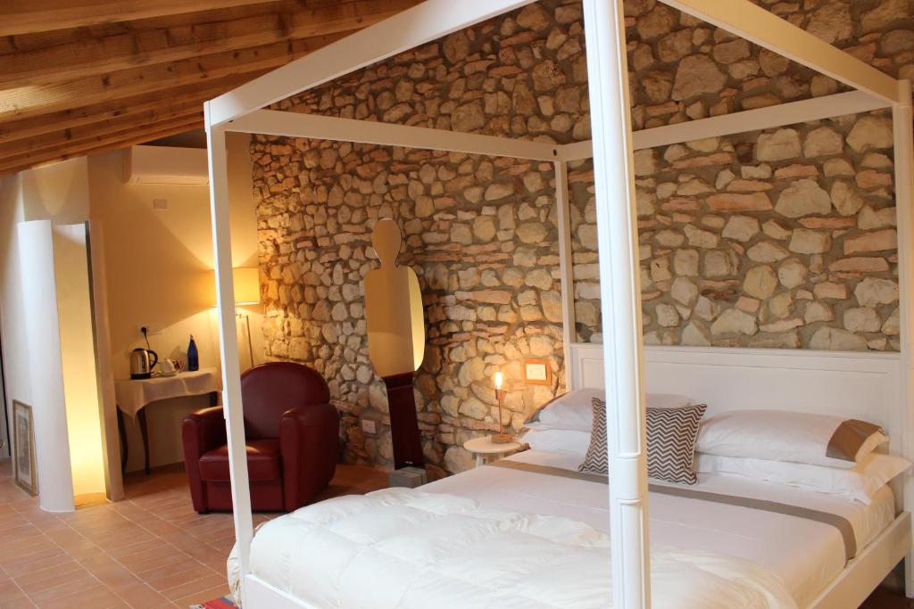 Postel nebo postele na pokoji v ubytování Corte Tre Vigne