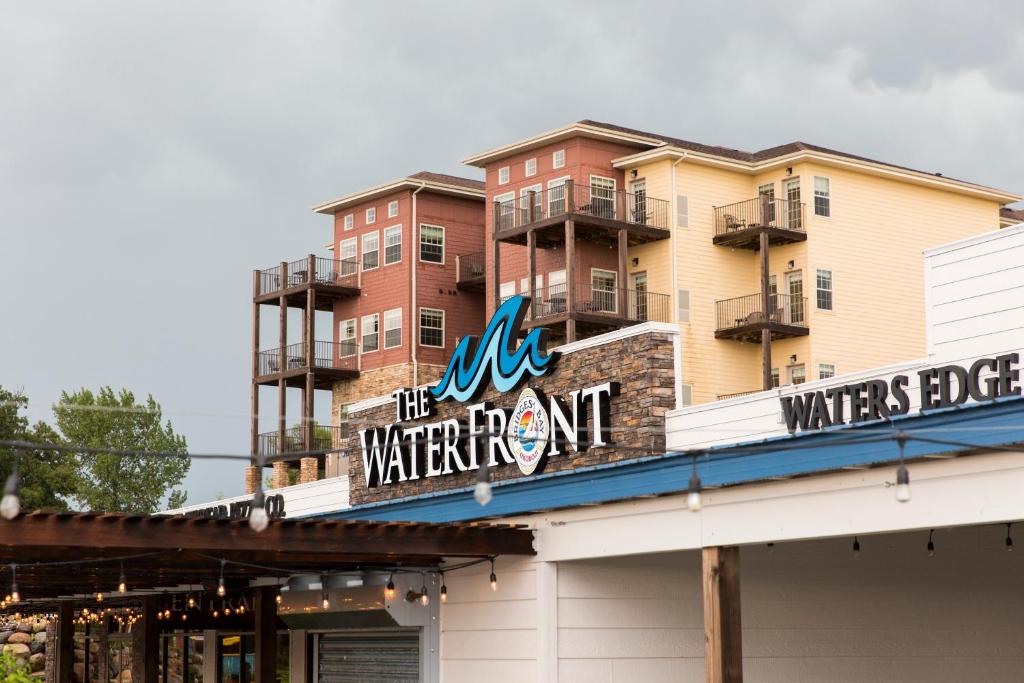 a building with a sign that reads all the waiting room at Bridges Bay Resort in Arnolds Park